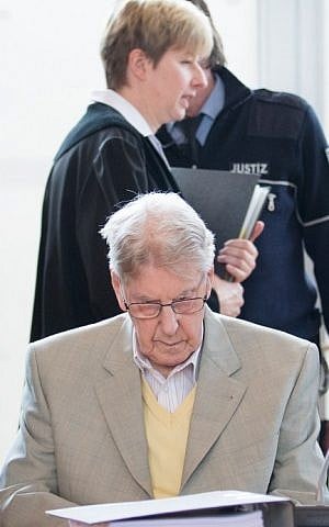 Judge Anke Grudda walks behind the defendant, former Auschwitz guard Reinhold Hanning in court for the continuation of his trial at the court in Detmold, western Germany, on February 26, 2016. (Friso Gentsch/Pool/AFP)