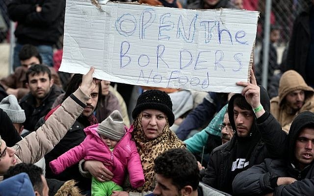 Refugees protest at the railroad tracks near the Greek-Macedonian borders near the village of Idomeni on February 28, 2016. (AFP / LOUISA GOULIAMAKI)