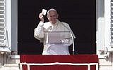Pope Francis addresses the crowd from the window of the apostolic palace overlooking St.Peter's square during his Sunday Angelus prayer on February 21, 2016 at the Vatican.  (AFP PHOTO/Filippo Monteforte)