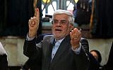 Iranian head of the reformists' coalition list for the parliamentary elections Mohammad Reza Aref shows his inked finger after casting his ballot at a polling station in Tehran, February 26, 2016. (AFP/ATTA KENARE)