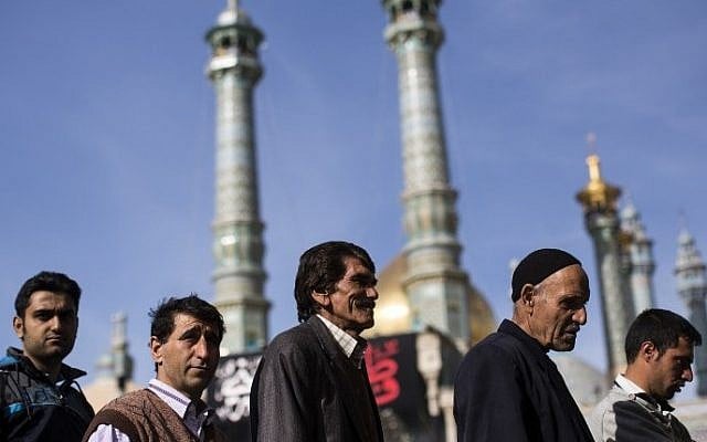 Iranian men line up to vote for both parliamentary elections and the Assembly of Experts at a polling station at Massoumeh shrine in the holy city of Qom, 130 kms south of Tehran, on February 26, 2016 (AFP PHOTO / BEHROUZ MEHRI) Iranian men line up to vote for both parliamentary elections and the Assembly of Experts at a polling station at Massoumeh shrine in the holy city of Qom, 130 kms south of Tehran, on February 26, 2016 (AFP PHOTO / BEHROUZ MEHRI)