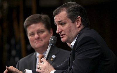 Republican presidential candidate Sen. Ted Cruz (R-TX) (R) participates in the South Carolina Faith and Family Presidential Forum as moderator Oran Smith (L) listens February 12, 2016 in Greenville, South Carolina. (Alex Wong/Getty Images/AFP)