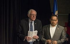 Rep. Keith Ellison (D-MN) introduces Democratic presidential candidate Sen. Bernie Sanders (D-VT) at a forum on race and economic opportunity at Patrick Henry High School on February 12, 2016 in Minneapolis, Minnesota. (Stephen Maturen/Getty Images/AFP)