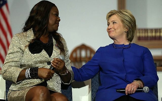 US presidential candidate Hillary Clinton listens as Sybrina Fulton, mother of Trayvon Martin, speaks at the Central Baptist Church February 23, 2016 in Columbia, South Carolina. (Win McNamee/Getty Images/AFP) US presidential candidate Hillary Clinton listens as Sybrina Fulton, mother of Trayvon Martin, speaks at the Central Baptist Church February 23, 2016 in Columbia, South Carolina. (Win McNamee/Getty Images/AFP)