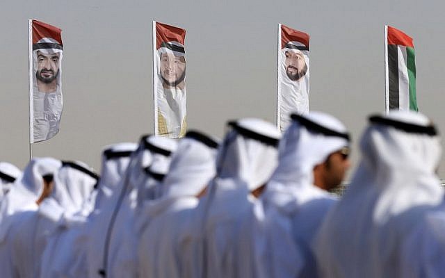 Emirati men perform a traditional dance in front of flags bearing portraits of Abu Dhabi's Crown Prince Sheikh Mohammed bin Zayed al-Nahyan, February 9, 2016. (AFP/Karim Sahib/ File) Emirati men perform a traditional dance in front of flags bearing portraits of Abu Dhabi's Crown Prince Sheikh Mohammed bin Zayed al-Nahyan, February 9, 2016. (AFP/Karim Sahib/ File)