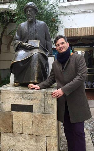Haim Casas poses at the statue of Maimonides in Cordoba, Spain. (Courtesy)