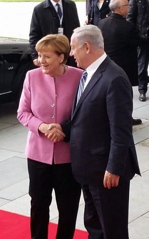 Prime Minister Benjamin Netanyahu, right, being greeted by German Chancellor Angela Merkel on Berlin on February 16, 2016. (Raphael Ahren/Times of Israel)