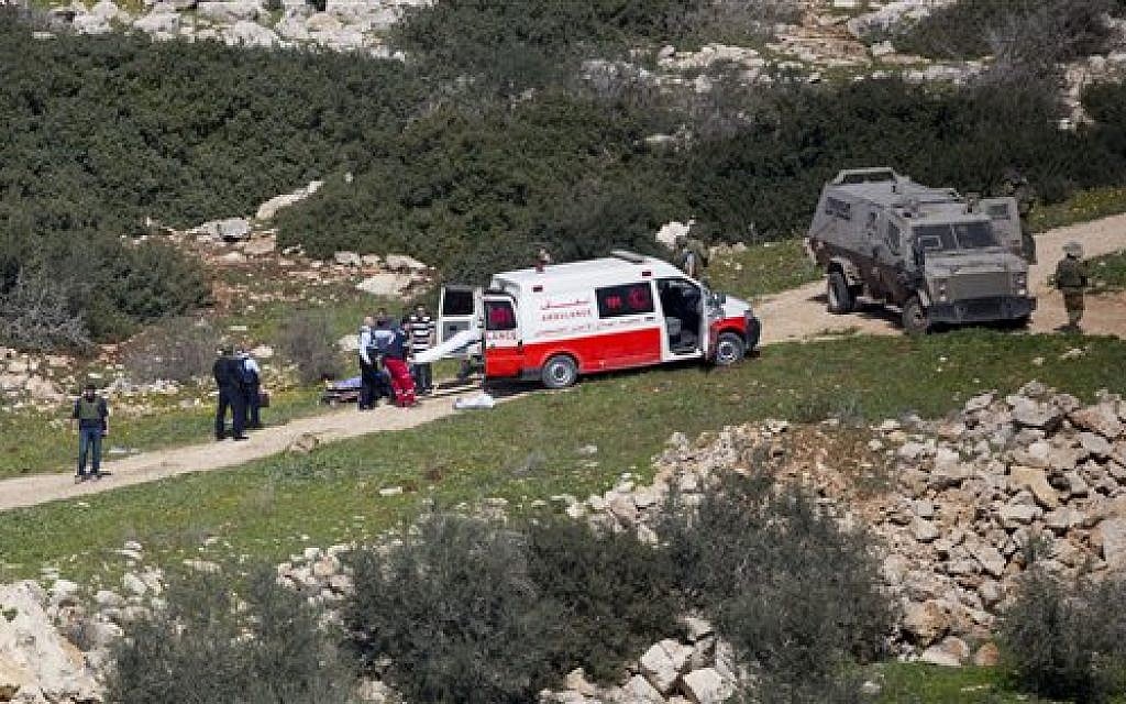 Palestinian medics load bodies of two Palestinians near the village of Aeraqh near the West Bank city of Jenin, Sunday, Feb. 14, 2016, after they were shot dead in a firefight with Israeli soldiers (AP Photo/Majdi Mohammed)