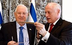Conference of Presidents Executive Vice Chairman Malcolm Hoenlein presents President Reuven (Ruby) Rivlin with a Yad Torah during the COP 2016 Leadership Mission to Israel, February 18, 2016. (Avi Hayun)