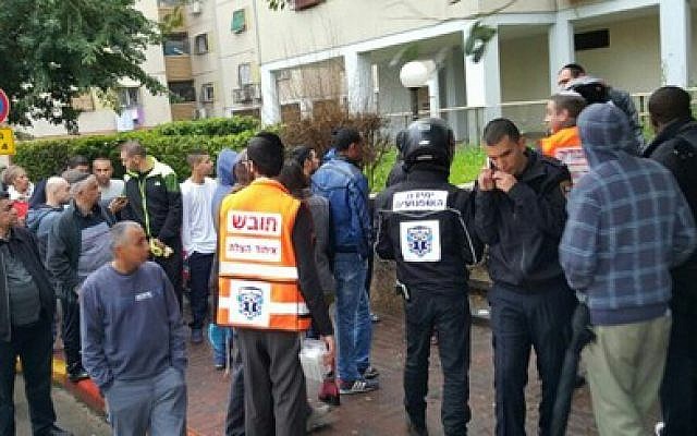 Paramedics and onlookers at the scene of a stabbing in the central Israeli town of Ramle on February 8, 2016. (Hatzolah) Paramedics and onlookers at the scene of a stabbing in the central Israeli town of Ramle on February 8, 2016. (Hatzolah)