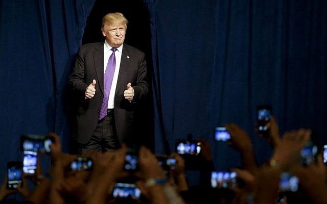 Republican presidential candidate Donald Trump arrives for a caucus night rally Tuesday, February 23, 2016, in Las Vegas. (AP Photo/Jae C. Hong) Republican presidential candidate Donald Trump arrives for a caucus night rally Tuesday, February 23, 2016, in Las Vegas. (AP Photo/Jae C. Hong)