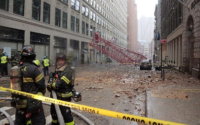 A collapsed crane lies on the street on Friday, Feb. 5, 2016, in New York. (AP Photo/Bebeto Matthews) A collapsed crane lies on the street on Friday, Feb. 5, 2016, in New York. (AP Photo/Bebeto Matthews)