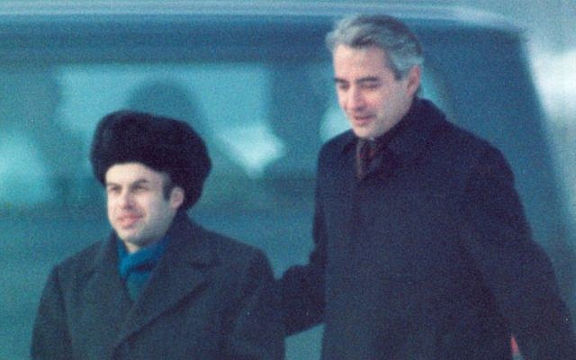 Natan (Anatoly) Sharansky is escorted by US Ambassador Richard Burt after Sharansky had crossed the border at Glienicker Bridge on Feb. 11, 1986 at the start of an East-West spy and prisoner exchange in Berlin. (AP Photo/Heribert Proepper)