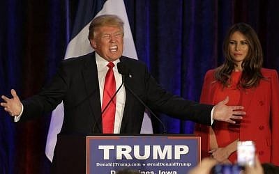 Republican presidential candidate, businessman Donald Trump speaks as his wife Melania watches at his caucus night rally, Monday, Feb. 1, 2016, in West Des Moines, Iowa. (Jae C. Hong/AP) 