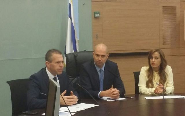 Likud MK Amir Ohana (center) flanked by Public Security Minister Gilad Erdan (left) and Likud MK Nava Boker in the first meeting of a Knesset caucus on lobbying for less restrictive gun control at the Knesset in Jerusalem on Monday, February 15 2016. (Knesset) Likud MK Amir Ohana (center) flanked by Public Security Minister Gilad Erdan (left) and Likud MK Nava Boker in the first meeting of a Knesset caucus on lobbying for less restrictive gun control at the Knesset in Jerusalem on Monday, February 15 2016. (Knesset)