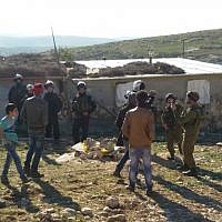 Soldiers from Israel's Civil Administration demolish a number of structures deemed illegal in the southern Hebron Hills on February 2, 2016. (Nasser Nawaja/B'Tselem) Soldiers from Israel's Civil Administration demolish a number of structures deemed illegal in the southern Hebron Hills on February 2, 2016. (Nasser Nawaja/B'Tselem)