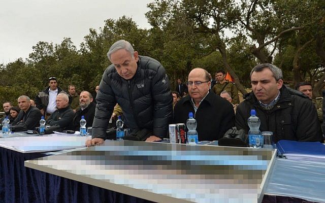 Prime Minister Benjamin Netanyahu, Defense Minister Moshe Ya'alon and Absorption Minister Ze'ev Elkin on a tour of Israel's north on Tuesday, February 2, 2016 (Prime Minister's Office)