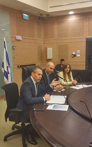 Likud MK Amir Ohana (center) flanked by Public Security Minister Gilad Erdan (left) and Likud MK Nava Boker in the first meeting of a Knesset caucus on lobbying for less restrictive gun control at the Knesset in Jerusalem on Monday, February 15 2016. (Knesset) Likud MK Amir Ohana (center) flanked by Public Security Minister Gilad Erdan (left) and Likud MK Nava Boker in the first meeting of a Knesset caucus on lobbying for less restrictive gun control at the Knesset in Jerusalem on Monday, February 15 2016. (Knesset)