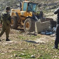 Soldiers from Israel's Civil Administration demolish a number of structures deemed illegal in the southern Hebron Hills on February 2, 2016. (Nasser Nawaja/B'Tselem) Soldiers from Israel's Civil Administration demolish a number of structures deemed illegal in the southern Hebron Hills on February 2, 2016. (Nasser Nawaja/B'Tselem)