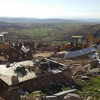 Soldiers from Israel's Civil Administration demolish a number of structures deemed illegal in the southern Hebron Hills on February 2, 2016. (Nasser Nawaja/B'Tselem) Soldiers from Israel's Civil Administration demolish a number of structures deemed illegal in the southern Hebron Hills on February 2, 2016. (Nasser Nawaja/B'Tselem)