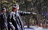 Eric Harris (L) watches as Dylan Klebold practices shooting a gun at a makeshift shooting range March 6, 1999 in Douglas County, CO in this image from video released by the Jefferson County Sheriff's Department. (Photo by Jefferson County Sheriff's Department/JTA via Getty Images)