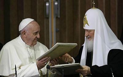 Pope Francis, left, embraces Russian Orthodox Patriarch Kirill after signing a joint declaration on religious unity at the Jose Marti International airport in Havana, Cuba, Friday, Feb. 12, 2016 (AP Photo/Gregorio Borgia, Pool)