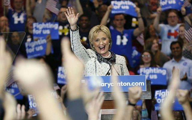 Democratic presidential candidate Hillary Clinton acknowledges supporters at her election night watch party after winning the South Carolina Democratic primary in Columbia, South Carolina, Saturday, Feb. 27, 2016. (AP Photo/Gerald Herbert)