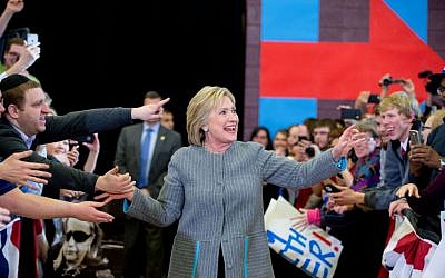 Democratic presidential candidate Hillary Clinton greets supporters as she arrives at a rally at Abraham Lincoln High School in Des Moines, Iowa, Sunday, Jan. 31, 2016. (AP Photo/Andrew Harnik)