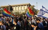 Illustrative: Israelis walking past the Knesset during the annual gay parade in Jerusalem, July 29, 2010. (Miriam Alster/FLASH90)
