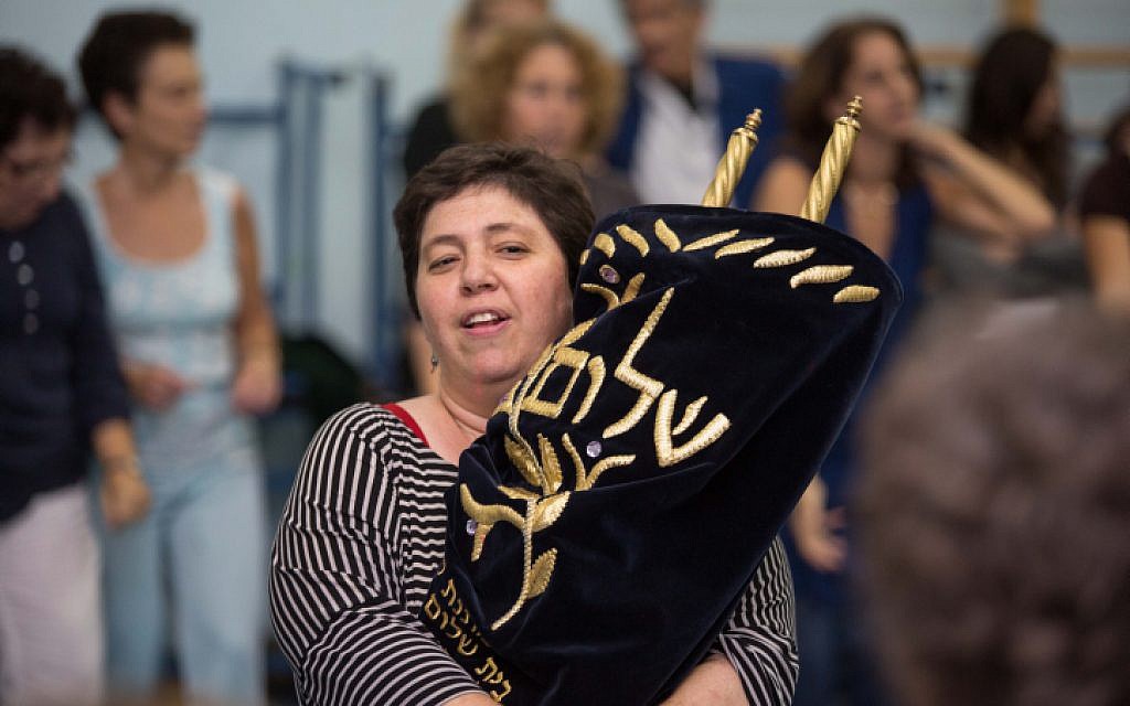 Reform Jews from 'Kol Haneshama' congregation in Kiryat Yovel sing and dance as they carry Torah scrolls during the celebration of Simhat Torah at the end of the Jewish holiday of Sukkot, on Oct 8,2012. (Oren Nahshon / FLASH90) Reform Jews from 'Kol Haneshama' congregation in Kiryat Yovel sing and dance as they carry Torah scrolls during the celebration of Simhat Torah at the end of the Jewish holiday of Sukkot, on Oct 8,2012. (Oren Nahshon / FLASH90)