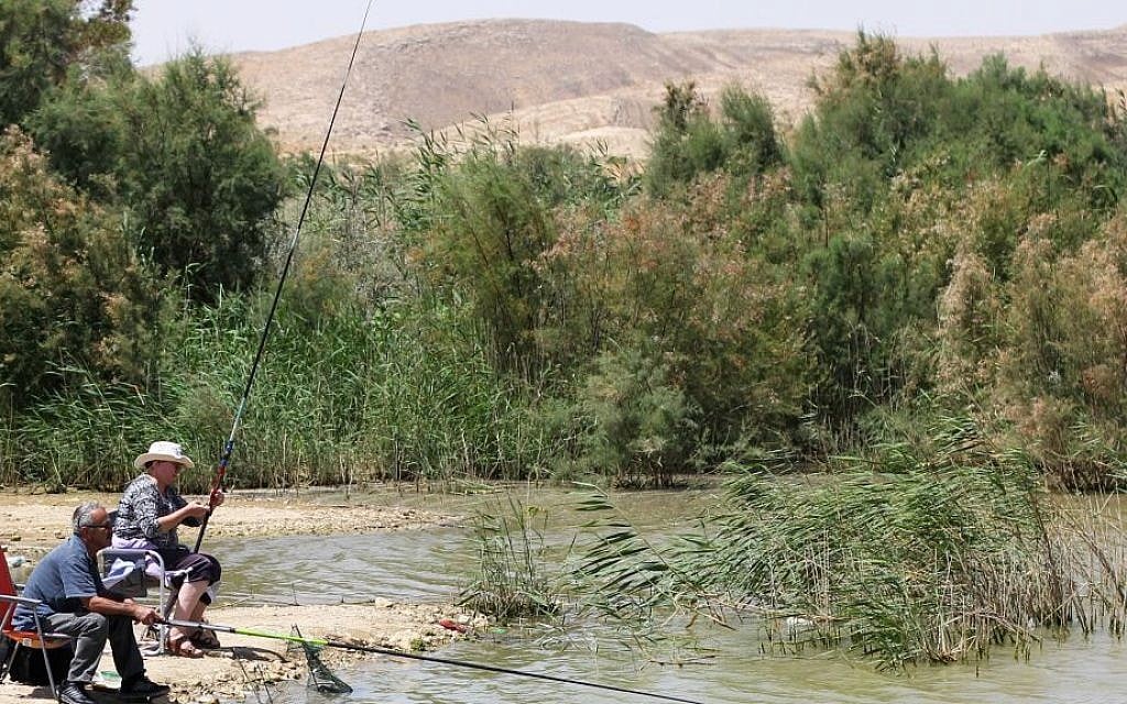 Fishing in Lake Yeruham, where sunbathing and picnics are always a good idea (Garrett Mills/Flash 90)