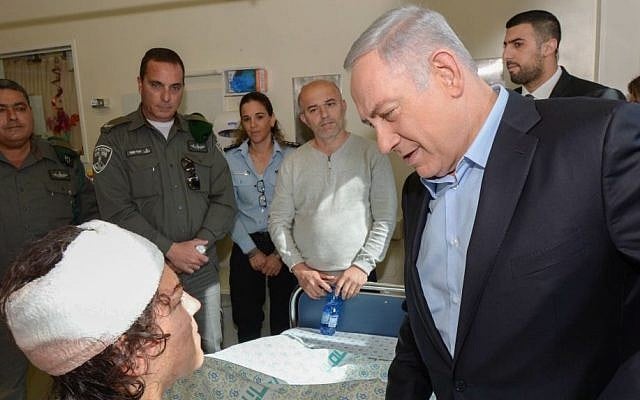 Israeli Prime Minister Benjamin Netanyahu visits a wounded Israeli border police officer at the Hadassah Hospital in Mount Scopus on February 4, 2016. Mirilashvili was injured a day earlier in a shooting and stabbing attack near Damascus Gate in Jerusalem. Her colleague Hadar Cohen was killed. (Amos Ben Gershom/GPO) Israeli Prime Minister Benjamin Netanyahu visits a wounded Israeli border police officer at the Hadassah Hospital in Mount Scopus on February 4, 2016. Mirilashvili was injured a day earlier in a shooting and stabbing attack near Damascus Gate in Jerusalem. Her colleague Hadar Cohen was killed. (Amos Ben Gershom/GPO)