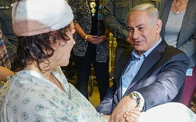 Israeli Prime Minister Benjamin Netanyahu visits a wounded Israeli border police officer at the Hadassah Hospital in Mount Scopus on February 4, 2016. Mirilashvili was injured a day earlier in a shooting and stabbing attack near Damascus Gate in Jerusalem. Her colleague Hadar Cohen was killed. (Amos Ben Gershom/GPO) Israeli Prime Minister Benjamin Netanyahu visits a wounded Israeli border police officer at the Hadassah Hospital in Mount Scopus on February 4, 2016. Mirilashvili was injured a day earlier in a shooting and stabbing attack near Damascus Gate in Jerusalem. Her colleague Hadar Cohen was killed. (Amos Ben Gershom/GPO)