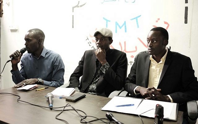 Alhaj Tom (left), a member of the Sudanese refugee community, discusses a stabbing attack in Ashkelon that is believed to have been carried out by a Sudanese man, in Tel Aviv on February 8, 2016. (Tomer Neuberg/Flash90) Alhaj Tom (left), a member of the Sudanese refugee community, discusses a stabbing attack in Ashkelon that is believed to have been carried out by a Sudanese man, in Tel Aviv on February 8, 2016. (Tomer Neuberg/Flash90)