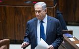 Prime Minister Benjamin Netanyahu rises to speak in the Knesset  on February 8, 2016. (Yonatan Sindel/Flash90)