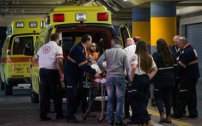 Medics wheel a wounded Israeli man, stabbed in a terror attack, into the emergency room of the Shaare Zedek Medical Center on February 9, 2016. (Yonatan Sindel/Flash90