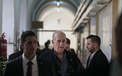 Former prime minister Ehud Olmert leaves the Jerusalem Magistrate's Court on February 10, 2016. (Ohad Zwigenberg/Pool)
