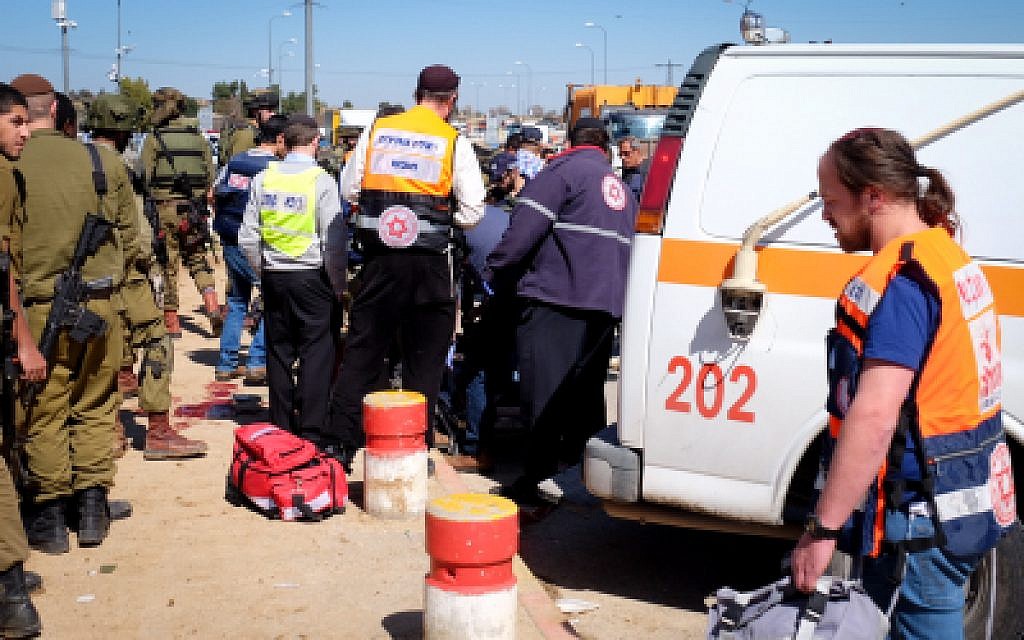 Security forces and rescue personnel at the scene of a terror attack at Gush Etzion Junction, on February 24, 2016. (Gershon Elinson/FLASH90) Security forces and rescue personnel at the scene of a terror attack at Gush Etzion Junction, on February 24, 2016. (Gershon Elinson/FLASH90)
