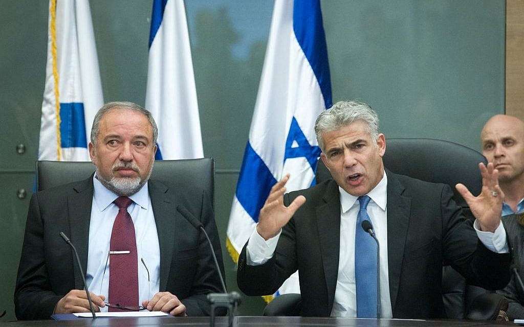 Yair Lapid, right, and Avigdor Liberman, lead a joint conference in Knesset on February 29, 2016. (Miriam Alster/FLASH90)