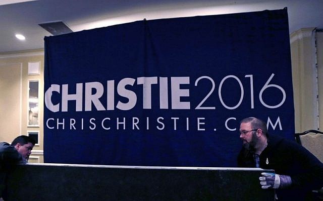 Campaign workers breaking down the primary night rally stage for Republican presidential candidate, New Jersey Gov. Chris Christie in Nashua, N.H., February 10, 2016. (AP Photo/Charles Krupa)