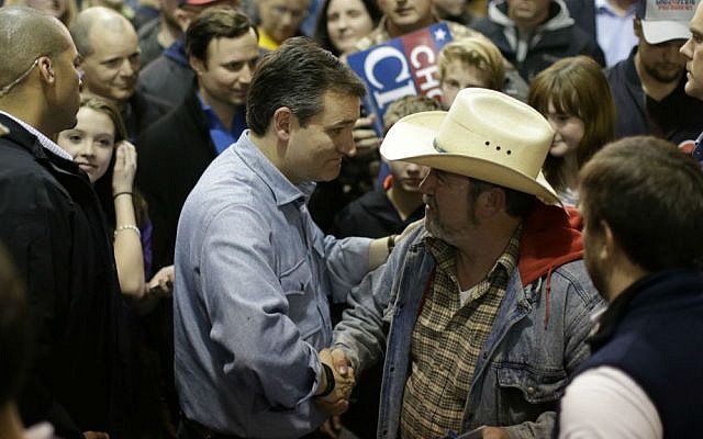 Republican presidential candidate, Sen. Ted Cruz, R-Texas, shakes hands with a supporter at Iowa State Fairgrounds, Sunday, Jan. 31, 2016, in Des Moines, Iowa. (AP Photo/Chris Carlson)