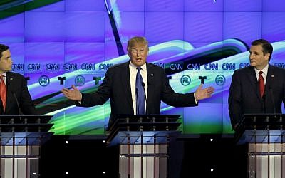 Republican presidential candidate Donald Trump, center, speaks as fellow candidates Sen. Marco Rubio, R-Florida, left, and Ted Cruz, R-Texas, look on during a Republican presidential primary debate at the University of Houston in Houston, Texas, Thursday, Feb. 25, 2016. (AP Photo/David J. Phillip)