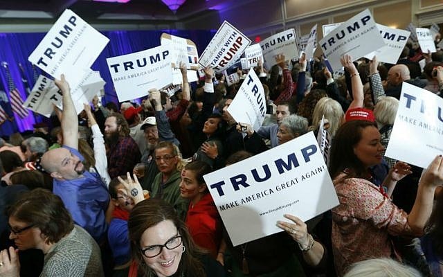 Supporters for Republican presidential candidate Donald Trump hold signs during a South Carolina Republican primary night event Saturday, Feb. 20, 2016, in Spartanburg, South Carolina. (AP Photo/Paul Sancya) Supporters for Republican presidential candidate Donald Trump hold signs during a South Carolina Republican primary night event Saturday, Feb. 20, 2016, in Spartanburg, South Carolina. (AP Photo/Paul Sancya)
