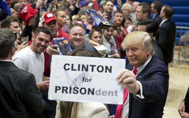 Republican presidential candidate Donald Trump pauses with a sign with his autograph on it while greeting his supporters at a rally Sunday, Jan. 31, 2016, in Council Bluffs, Iowa. (AP Photo/Jae C. Hong) Republican presidential candidate Donald Trump pauses with a sign with his autograph on it while greeting his supporters at a rally Sunday, Jan. 31, 2016, in Council Bluffs, Iowa. (AP Photo/Jae C. Hong)