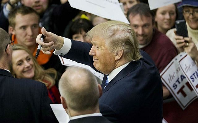 Republican presidential candidate Donald Trump gestures to the crowd as he signs autographs at a campaign event at Plymouth State University Sunday, Feb. 7, 2016, in Plymouth, New Hampshire. (AP Photo/David Goldman) Republican presidential candidate Donald Trump gestures to the crowd as he signs autographs at a campaign event at Plymouth State University Sunday, Feb. 7, 2016, in Plymouth, New Hampshire. (AP Photo/David Goldman)