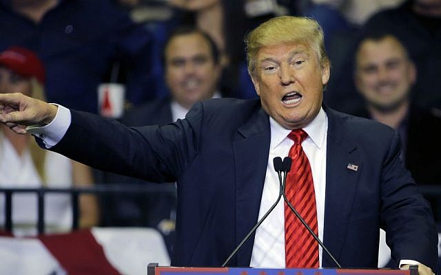 Republican presidential candidate Donald Trump gestures as he speaks to supporters during a rally Friday, Feb. 12, 2016, in Tampa, Florida. (AP Photo/Chris O'Meara)