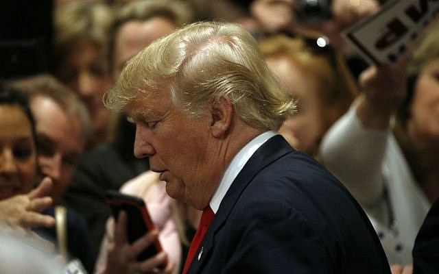 Republican presidential candidate Donald Trump meets with attendees during a campaign stop Friday, Feb. 19, 2016, in North Charleston, South Carolina. (AP Photo/Matt Rourke)