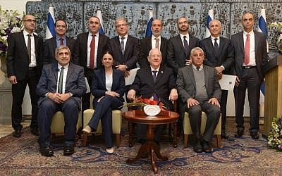 President Reuven Rilvin and Justice Minister Ayelet Shaked (center front) pose with new Israeli sharia judges during a ceremony at the President's Residence in Jerusalem on Tuesday, February 9, 2016 (Mark Neyman/GPO)