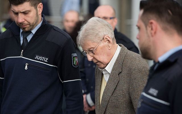 94-year-old former SS guard at the Auschwitz death camp Reinhold Hanning, center, leaves the building after the opening of his trial in Detmold, Germany, Thursday, Feb. 11, 2016. (Bernd Thissen/Pool Photo via AP) 94-year-old former SS guard at the Auschwitz death camp Reinhold Hanning, center, leaves the building after the opening of his trial in Detmold, Germany, Thursday, Feb. 11, 2016. (Bernd Thissen/Pool Photo via AP)