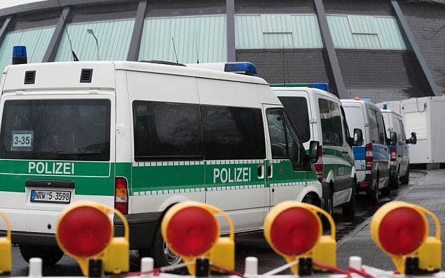 Police vehicles park in front of the reception facility for refugees located in a gymnasium in Attendorn, Germany, Thursday Feb. 4, 2016. (Bernd Thissen/dpa via AP) Police vehicles park in front of the reception facility for refugees located in a gymnasium in Attendorn, Germany, Thursday Feb. 4, 2016. (Bernd Thissen/dpa via AP)